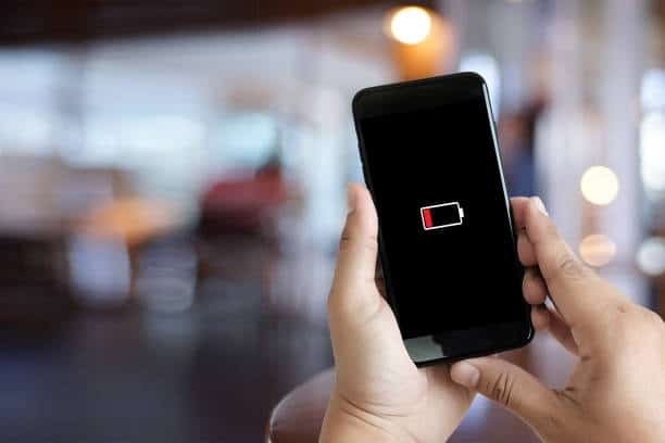 Smartphone low battery alert before charging with USB Type-C cable.