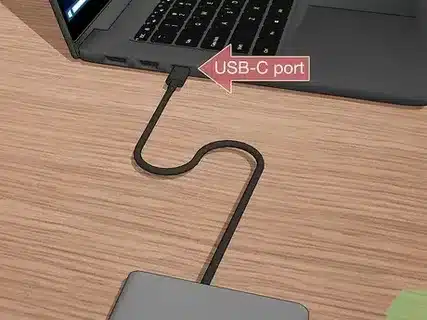 Charge laptop using USB C port connection.