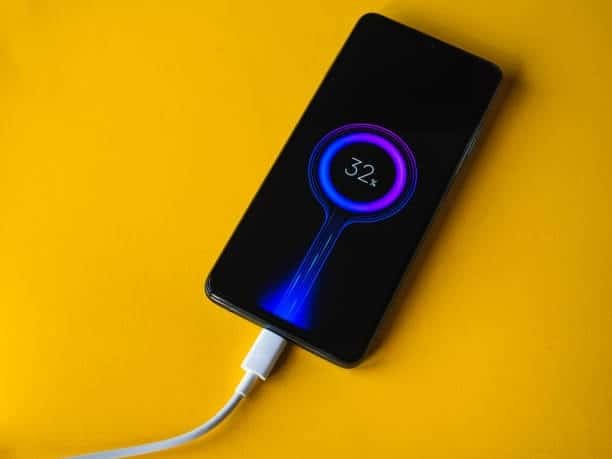 Smartphone showing fast charging with USB Type-C cable.