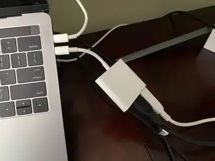 Laptop charging through USB C adapter hub.