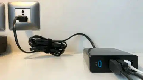 USB Type-C charging adapter connected to power outlet.