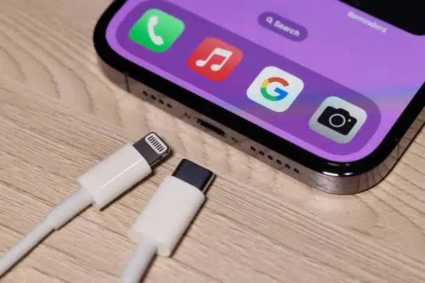 iPhone with usb c and lightning cable side by side