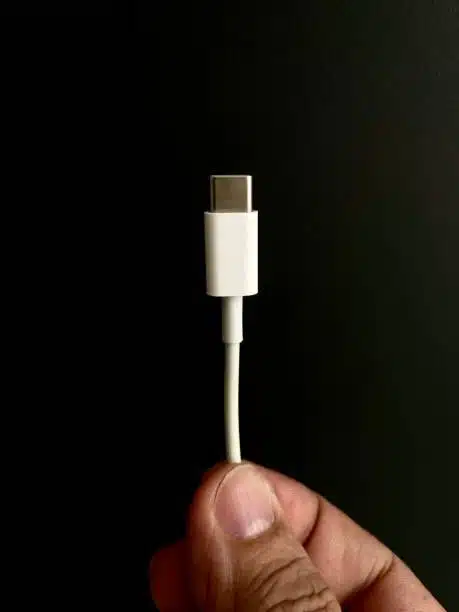 Hand holding usb c connector cable