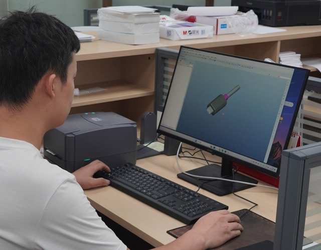 Engineer at Kingda Cables using CAD software to design a custom cable solution