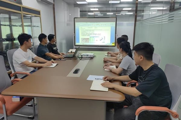 Kingda Cables team conducting a project meeting to discuss custom cable solutions and quality improvements