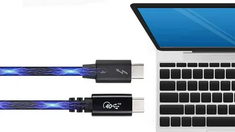 High-speed USB-C cable transferring power and data to laptop.