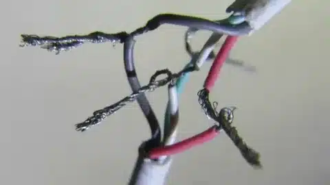 damaged charging cable showing frayed and disconnected internal wires