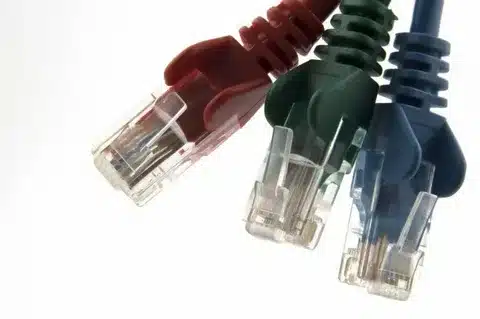 Ethernet RJ45 data cable connectors in red, green, and blue