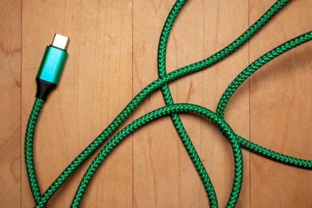 Green braided USB-C cable used for charging and speed test