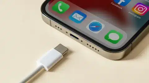 close-up of iPhone bottom with USB-C charging port and white cable