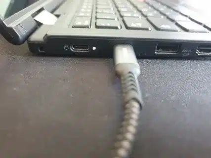 laptop charging via USB-C cable and adapter