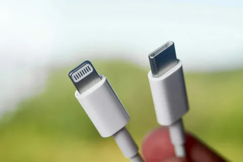 side by side comparison of iPhone Lightning connector and USB-C connector