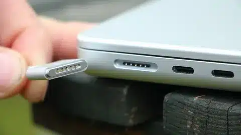 Apple MagSafe 3 connector next to USB-C ports on MacBook