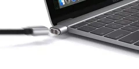 Magnetic MagSafe charger connecting to MacBook port