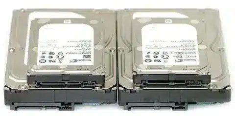 Two enterprise hard drives showing SAS and SATA connectors for interface comparison
