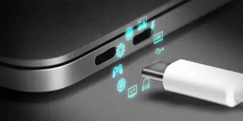 close-up of laptop USB-C port with charging and data icons
