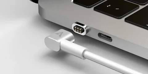 USB-C port and MagSafe adapter side by side on MacBook