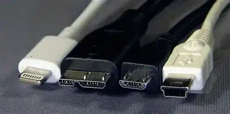 Various USB port types including Lightning, Micro USB, and Mini USB cables.