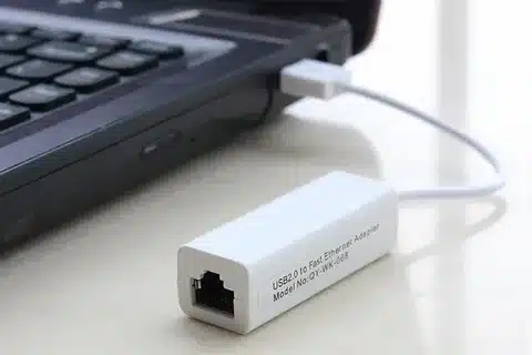 USB 2.0 to Ethernet adapter connected to laptop for fast internet