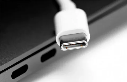 Close-up of USB Type-C cable end near laptop port