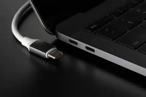 USB Type-C cable plugged into laptop USB-C ports